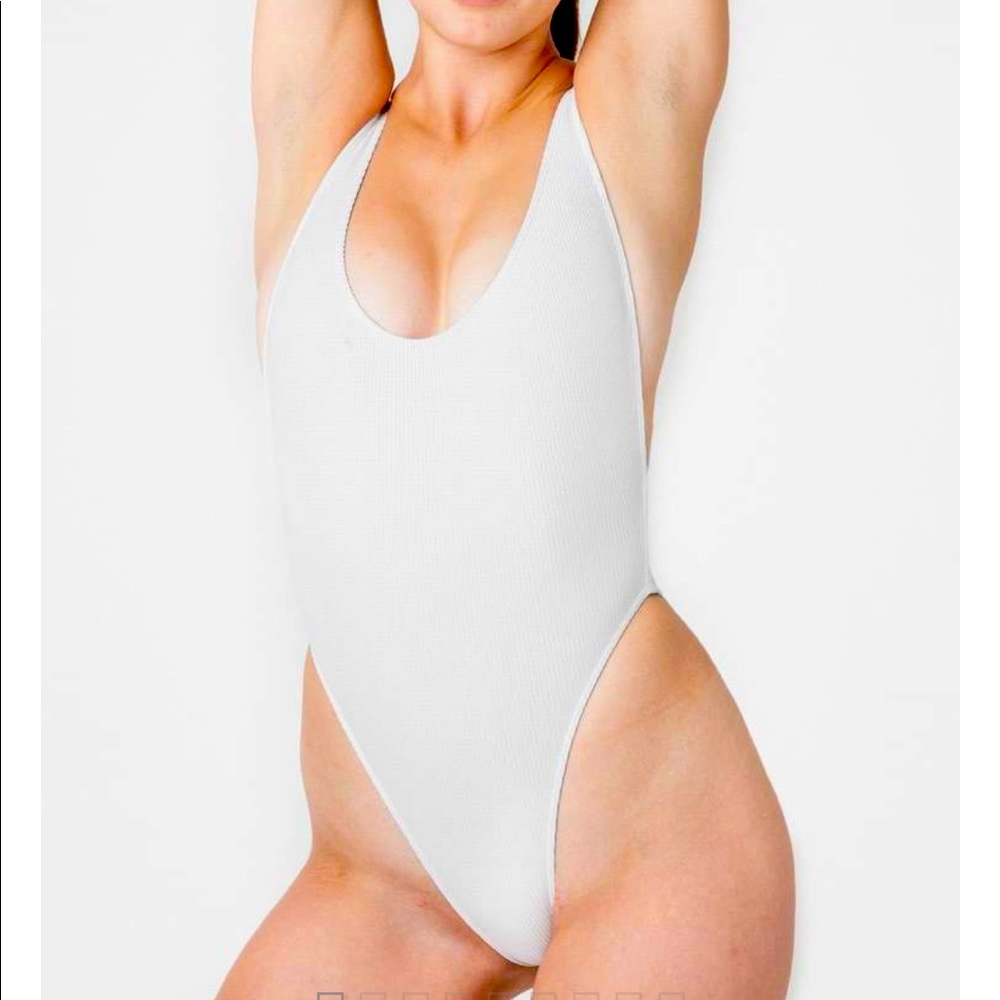 White RIBBED HIGH CUT ONE-PIECE SWIMSUIT. Never Worn.